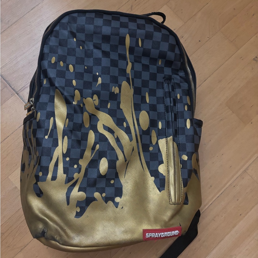 Sprayground Checkered Black and Gold Backpack